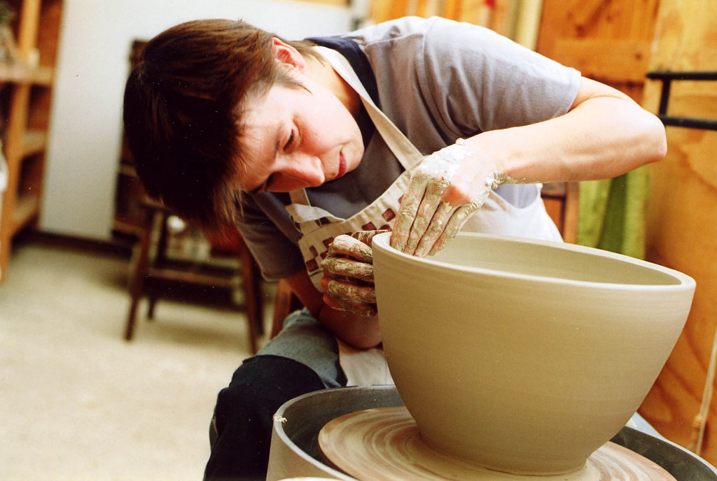 Linda Bloomfield: potter, designer, author, teacher and an expert on ceramic glazes, shown here throwing a pot on the wheel