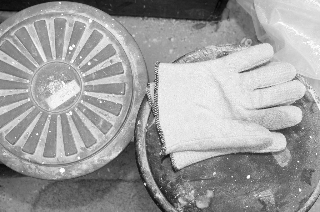 Bins of clay and heat-proof gloves
