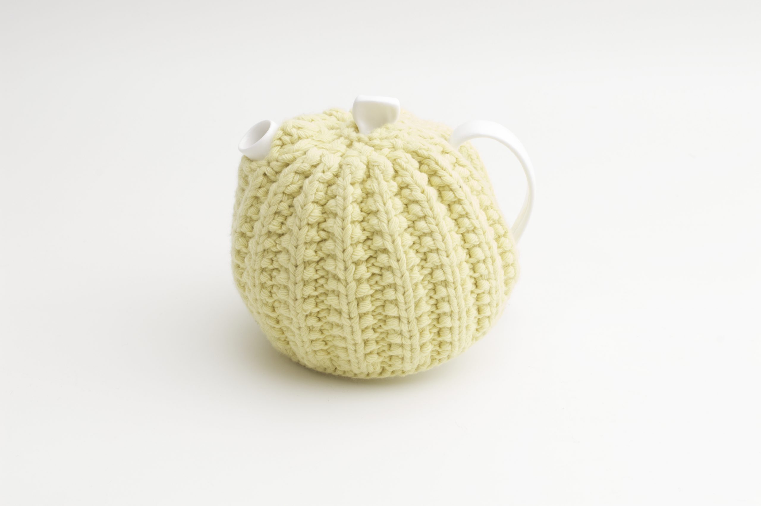 Bone China Teapot designed by Linda Bloomfield, with zesty lemon knitted cosy by Ruth Cross