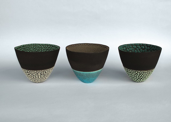 Emma Williams’ tall bowls, press-moulded black earthenware clay, barium and crawl glazes, 3 in. (8 cm) in height, 2014. Image: Courtesy of the artist